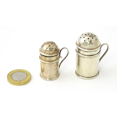 352 - Two silver pepperettes / pepper pots formed as flour shakers. hallmarked Birmingham 1900 maker T H H... 