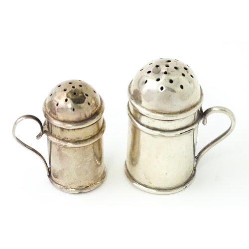 352 - Two silver pepperettes / pepper pots formed as flour shakers. hallmarked Birmingham 1900 maker T H H... 