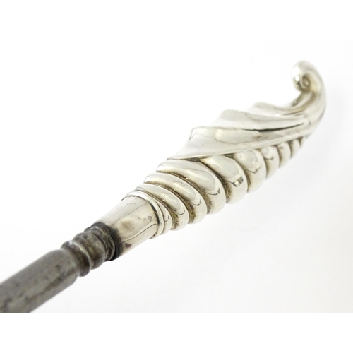 361 - Three various silver and white metal handled button hooks including one with floral and scroll detai... 