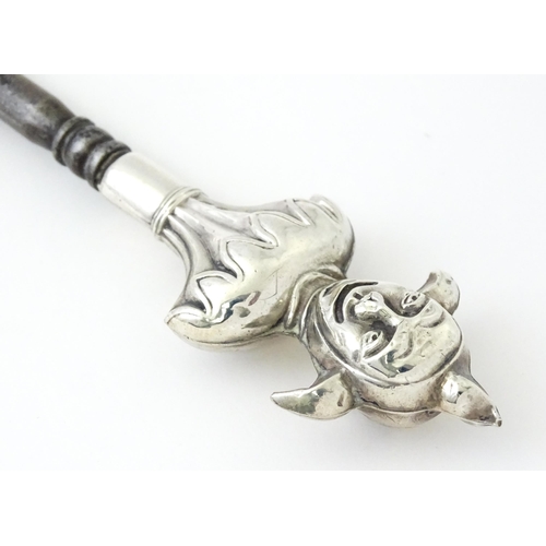 361 - Three various silver and white metal handled button hooks including one with floral and scroll detai... 