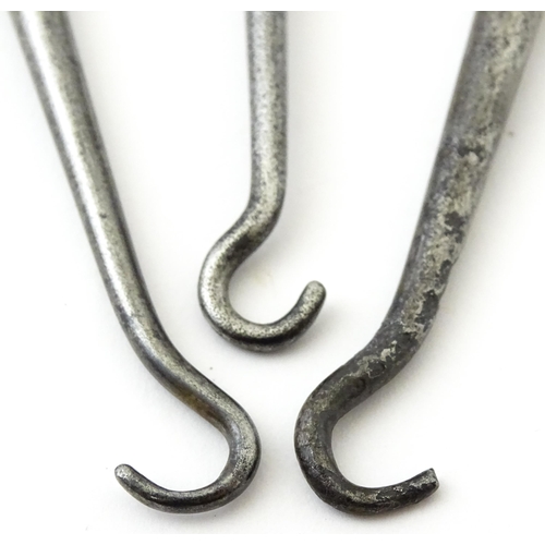 361 - Three various silver and white metal handled button hooks including one with floral and scroll detai... 