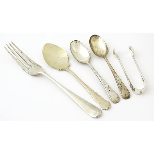 409 - Five assorted silver flatware to include a pair of teaspoons hallmarked London 1910, sugar tongs hal... 