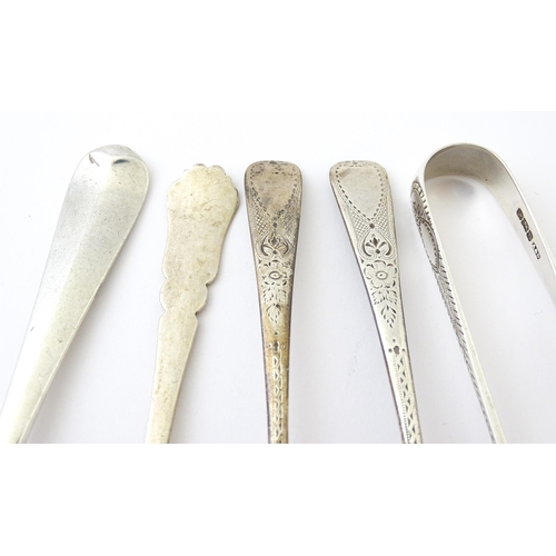 409 - Five assorted silver flatware to include a pair of teaspoons hallmarked London 1910, sugar tongs hal... 