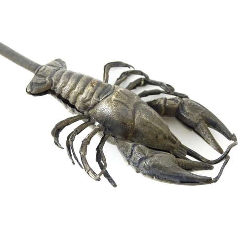 412 - Assorted items to include three silver plate meat skewers, a skewer surmounted by a model of a lobst... 
