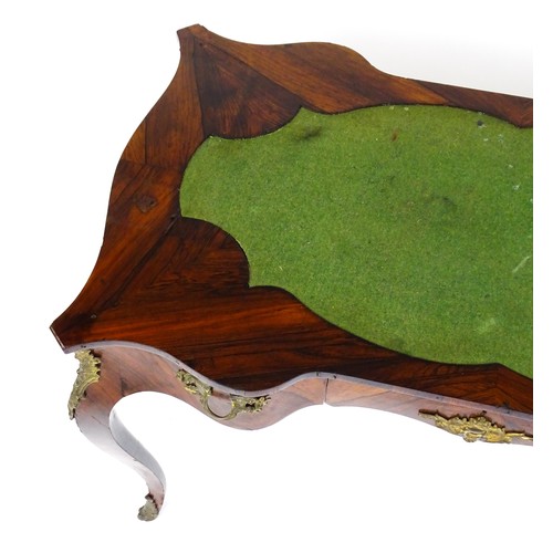 1428 - A 19thC rosewood bureau plat / writing desk with a shaped top above single short drawer and gilt mou... 