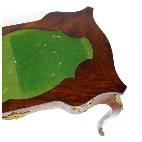 1428 - A 19thC rosewood bureau plat / writing desk with a shaped top above single short drawer and gilt mou... 