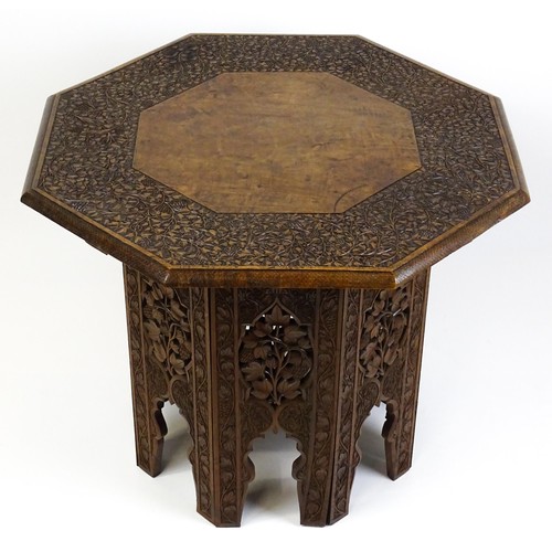 1429 - An early / mid 20thC Moorish table of unusually large proportions and walnut construction, with an o... 