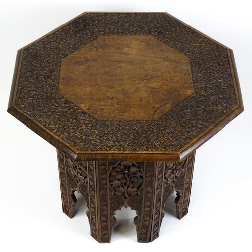 1429 - An early / mid 20thC Moorish table of unusually large proportions and walnut construction, with an o... 