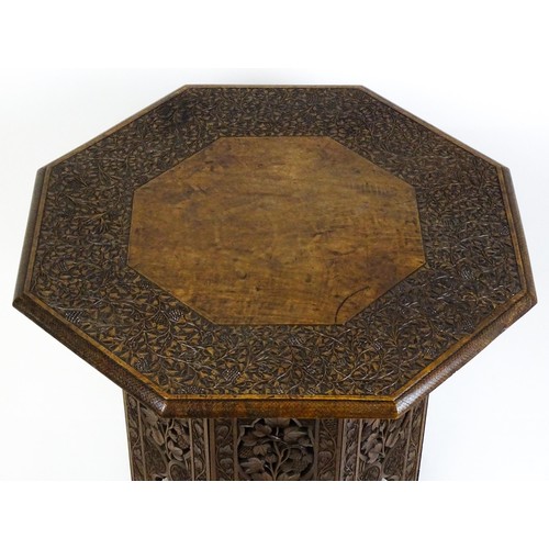 1429 - An early / mid 20thC Moorish table of unusually large proportions and walnut construction, with an o... 