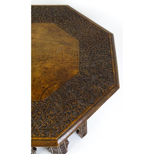 1429 - An early / mid 20thC Moorish table of unusually large proportions and walnut construction, with an o... 