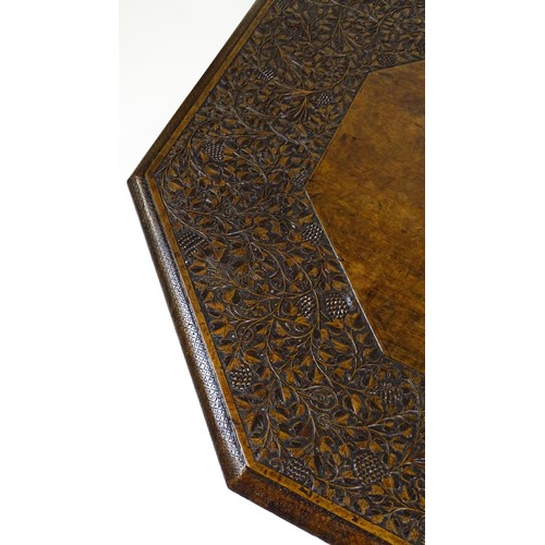 1429 - An early / mid 20thC Moorish table of unusually large proportions and walnut construction, with an o... 