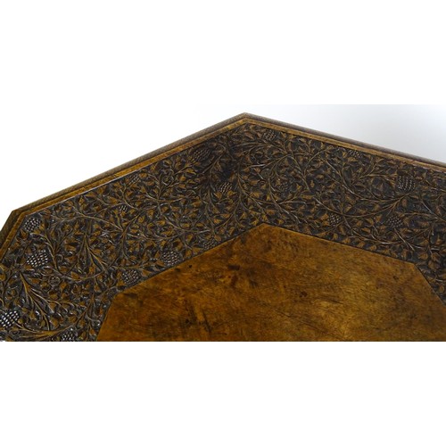 1429 - An early / mid 20thC Moorish table of unusually large proportions and walnut construction, with an o... 