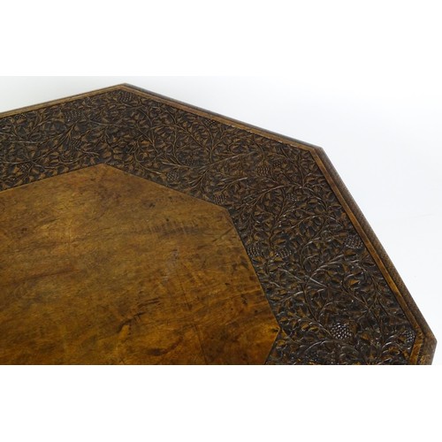 1429 - An early / mid 20thC Moorish table of unusually large proportions and walnut construction, with an o... 