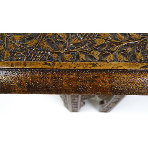 1429 - An early / mid 20thC Moorish table of unusually large proportions and walnut construction, with an o... 