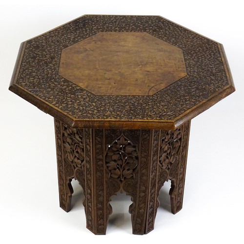 1429 - An early / mid 20thC Moorish table of unusually large proportions and walnut construction, with an o... 