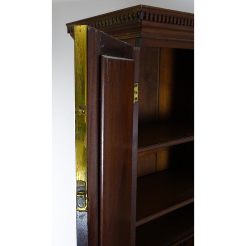1431 - A George II mahogany bureau bookcase with a moulded cornice above two mirrored doors opening to show... 