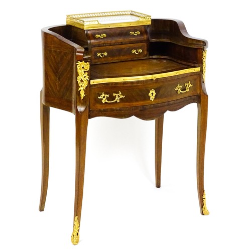 1469 - An early 20thC kingwood and rosewood Bonheur du jour surmounted by a marble panel and pierced gilt s... 