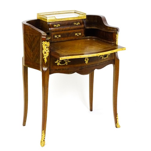 1469 - An early 20thC kingwood and rosewood Bonheur du jour surmounted by a marble panel and pierced gilt s... 