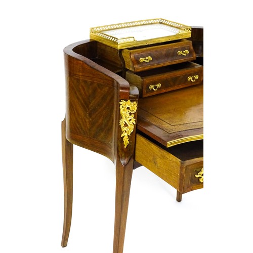 1469 - An early 20thC kingwood and rosewood Bonheur du jour surmounted by a marble panel and pierced gilt s... 