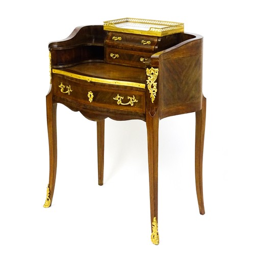 1469 - An early 20thC kingwood and rosewood Bonheur du jour surmounted by a marble panel and pierced gilt s... 