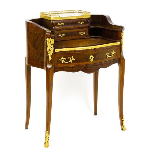1469 - An early 20thC kingwood and rosewood Bonheur du jour surmounted by a marble panel and pierced gilt s... 