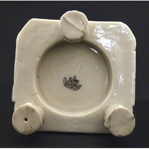 94 - A Belleek honey pot on stand of skep / beehive form decorated with bees, flowers and shamrocks. Rais... 