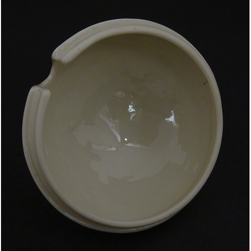 94 - A Belleek honey pot on stand of skep / beehive form decorated with bees, flowers and shamrocks. Rais... 