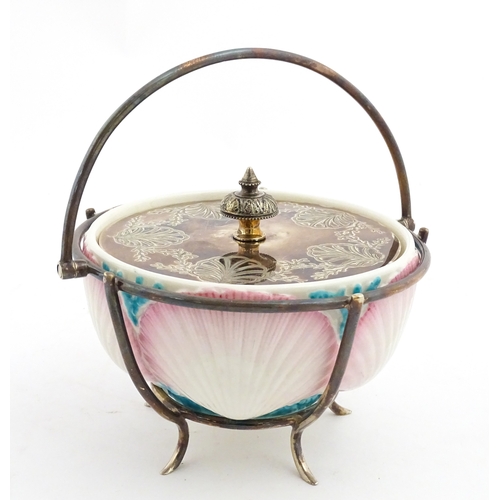 95 - A Belleek sugar bowl with pink scallop shell and blue painted detail, with a silver plate lid and st... 