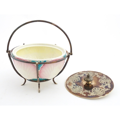 95 - A Belleek sugar bowl with pink scallop shell and blue painted detail, with a silver plate lid and st... 