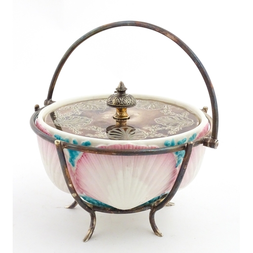 95 - A Belleek sugar bowl with pink scallop shell and blue painted detail, with a silver plate lid and st... 