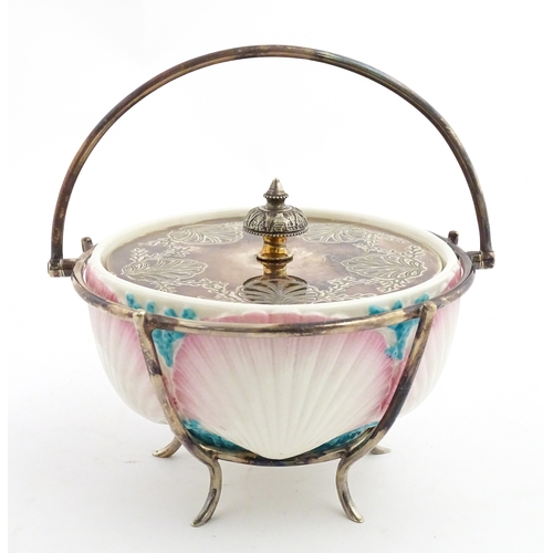 95 - A Belleek sugar bowl with pink scallop shell and blue painted detail, with a silver plate lid and st... 