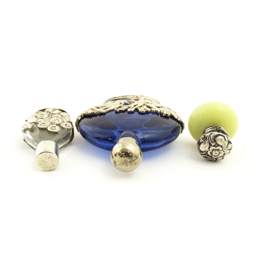 229 - Two glass scent / perfume bottles one with silver mounts / cover  hallmarked London 1990 together wi... 