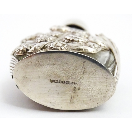 229 - Two glass scent / perfume bottles one with silver mounts / cover  hallmarked London 1990 together wi... 