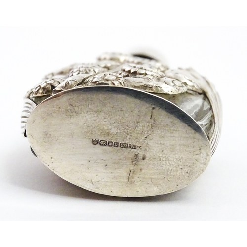 229 - Two glass scent / perfume bottles one with silver mounts / cover  hallmarked London 1990 together wi... 