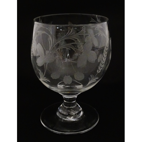198 - A exceptionally large pedestal glass decorated with etched hops and barley detail. Approx 8 1/2