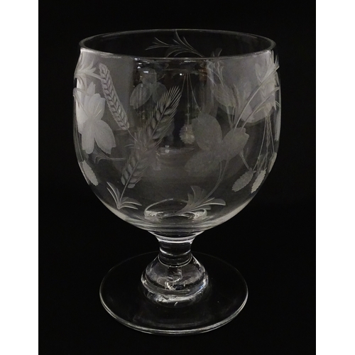 198 - A exceptionally large pedestal glass decorated with etched hops and barley detail. Approx 8 1/2