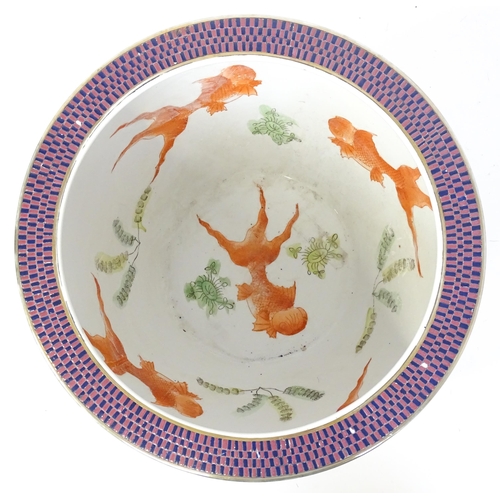 30 - A Chinese jardiniere decorated with panels depicting flowers and foliage, the interior decorated wit... 