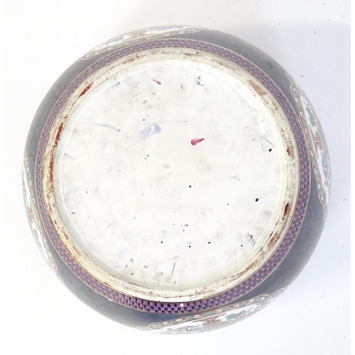 30 - A Chinese jardiniere decorated with panels depicting flowers and foliage, the interior decorated wit... 