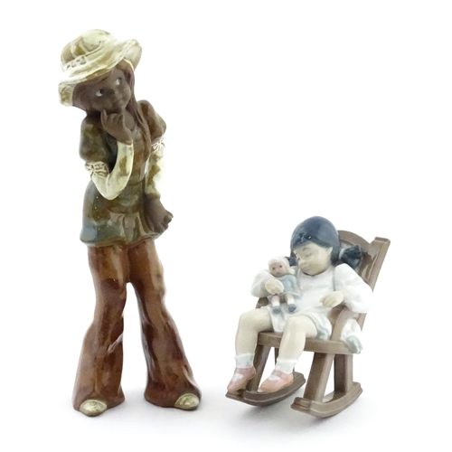182 - A Lladro model Nap Time, model no. 5448. Together with a ceramic model of a girl. Largest approx. 10... 