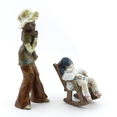 182 - A Lladro model Nap Time, model no. 5448. Together with a ceramic model of a girl. Largest approx. 10... 