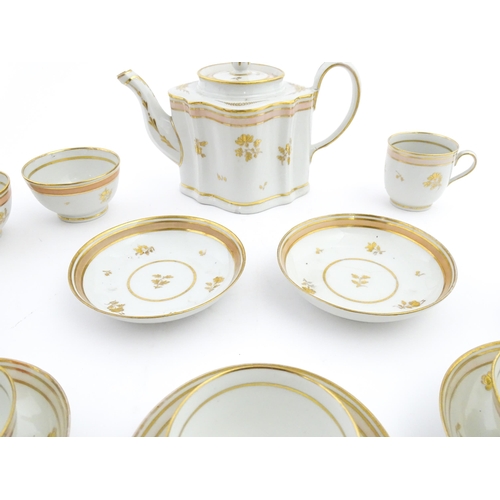 183 - 19thC New Hall tea wares decorated with a pink band and gilt detail, to include teapot, tea bowls, s... 