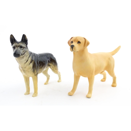 185 - Two Beswick models of dogs comprising a German Shepherd CH Ulrica of Brittas, and a Golden Labrador ... 