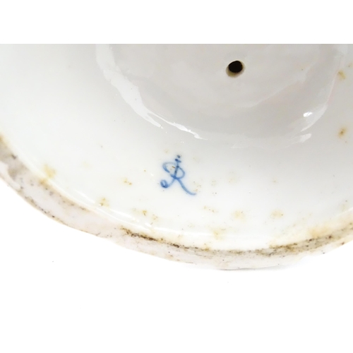 189 - A pair of Continental figural twin branch candlesticks modelled as shepherd and shepherdess, each wi... 