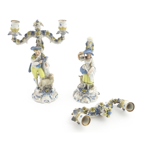 189 - A pair of Continental figural twin branch candlesticks modelled as shepherd and shepherdess, each wi... 