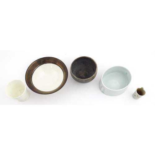 194 - Four studio pottery items to include an oval bowl by Antje Ernestus, a bowl by Richard Baxter, a sma... 
