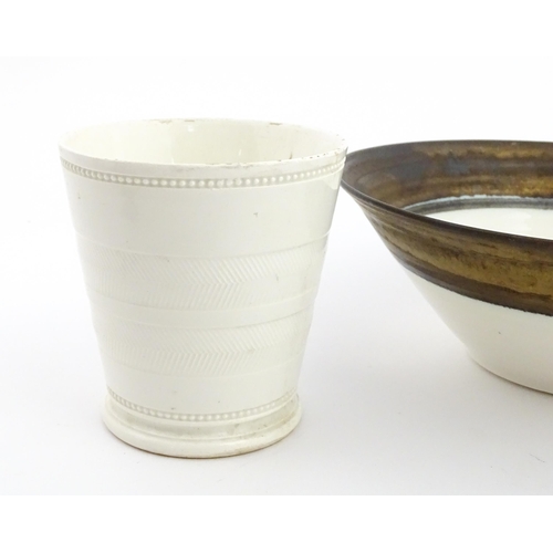 194 - Four studio pottery items to include an oval bowl by Antje Ernestus, a bowl by Richard Baxter, a sma... 