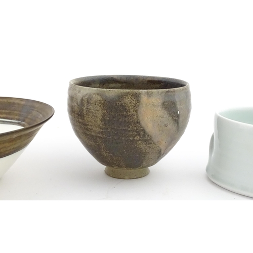 194 - Four studio pottery items to include an oval bowl by Antje Ernestus, a bowl by Richard Baxter, a sma... 