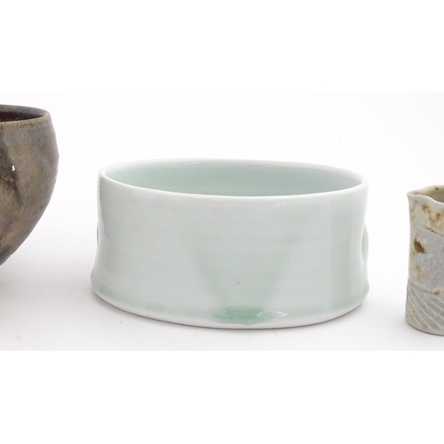 194 - Four studio pottery items to include an oval bowl by Antje Ernestus, a bowl by Richard Baxter, a sma... 