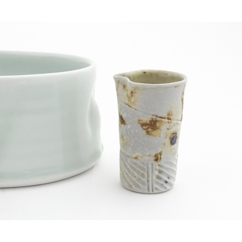 194 - Four studio pottery items to include an oval bowl by Antje Ernestus, a bowl by Richard Baxter, a sma... 