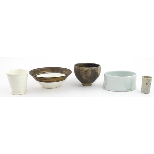 194 - Four studio pottery items to include an oval bowl by Antje Ernestus, a bowl by Richard Baxter, a sma... 
